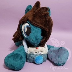Size: 1188x1188 | Tagged: safe, artist:appledew, earth pony, pony, beanie (plushie), camera, clothes, commission, irl, male, photo, plushie, ponified, prone, shirt, smiling, solo, stallion, t-shirt, tom sykes, watermark