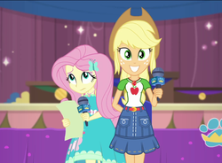 Size: 1464x1077 | Tagged: safe, screencap, applejack, fluttershy, best in show: the pre-show, equestria girls, g4, my little pony equestria girls: better together, applejack's skirt, clothes, cropped, denim, denim skirt, female, geode of fauna, geode of super strength, legs together, magical geodes, microphone, skirt