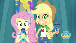 Size: 1920x1080 | Tagged: safe, screencap, applejack, fluttershy, best in show: the pre-show, equestria girls, g4, my little pony equestria girls: better together, applejack's hat, belt, best in show logo, clothes, cowboy hat, cute, cutie mark, cutie mark on clothes, denim skirt, female, geode of fauna, geode of super strength, grin, hairpin, hat, jackabetes, jewelry, magical geodes, microphone, necklace, shyabetes, skirt, smiling