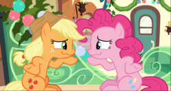 Size: 1606x857 | Tagged: safe, screencap, applejack, pinkie pie, earth pony, pony, g4, hearthbreakers, duo, female, freckles, friendship express, hooves on hips, looking at each other, mare, pointing, raised hoof, sitting, underhoof, wavy mouth
