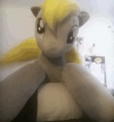 Size: 579x623 | Tagged: safe, artist:agatrix, derpy hooves, pegasus, pony, g4, animated, cute, derp, derpabetes, female, gif, irl, looking at you, loop, mare, perfect loop, photo, plushie, ponies in real life, smiling, solo, tail wag
