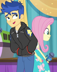 Size: 787x987 | Tagged: safe, screencap, flash sentry, fluttershy, best in show: the pre-show, equestria girls, g4, my little pony equestria girls: better together, clothes, cropped, female, hand in pocket, hoodie, male, microphone, pants, smiling