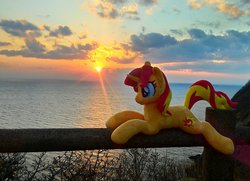 Size: 1984x1440 | Tagged: safe, artist:hihin1993, sunset shimmer, pony, unicorn, g4, female, irl, japan, mare, ocean, photo, plushie, smiling, solo, sun, sunset, sunshine shimmer