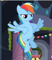 Size: 551x641 | Tagged: safe, screencap, rainbow dash, pegasus, pony, g4, hearth's warming eve (episode), cropped, female, flying, hooves on hips, mare, rainbow dash is not amused, solo, spread wings, unamused, wings