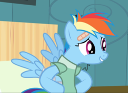 Size: 931x676 | Tagged: safe, screencap, rainbow dash, pegasus, pony, g4, read it and weep, bandage, cropped, female, hooves on hips, hospital gown, mare, messy mane, nervous smile, solo