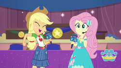 Size: 1920x1080 | Tagged: safe, screencap, applejack, fluttershy, best in show: the victory lap, equestria girls, g4, my little pony equestria girls: better together, female, geode of fauna, geode of super strength, looking at you, magical geodes, microphone