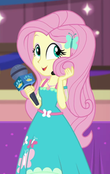 Size: 594x939 | Tagged: safe, screencap, fluttershy, best in show: the victory lap, equestria girls, equestria girls series, g4, spoiler:eqg series (season 2), beautiful, best in show logo, clothes, cropped, cute, dress, female, fluttershy boho dress, geode of fauna, magical geodes, microphone, playing with hair, shyabetes, smiling