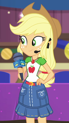 Size: 564x1004 | Tagged: safe, screencap, applejack, best in show: the victory lap, equestria girls, g4, my little pony equestria girls: better together, applejack's hat, belt, blonde hair, clothes, cowboy hat, cropped, cutie mark on clothes, denim, denim skirt, earpiece, geode of super strength, green eyes, grin, hand on hip, hat, headset, jewelry, low ponytail, magical geodes, microphone, necklace, orange skin, shirt, skirt, smiling, stetson, t-shirt