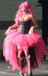 Size: 425x668 | Tagged: safe, pinkie pie, human, bronycon, bronycon 2013, g4, breasts, clothes, corset, cosplay, costume, female, irl, irl human, photo, pink, saloon dress, saloon pinkie, sexy, smiling, solo, stockings, thigh highs