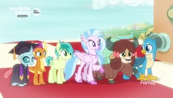 Size: 1920x1080 | Tagged: safe, screencap, gallus, ocellus, sandbar, silverstream, smolder, yona, changedling, changeling, classical hippogriff, dragon, griffon, hippogriff, pony, yak, g4, uprooted, bow, checkerboard, cloven hooves, dragoness, female, graduation cap, hair bow, hat, raised hoof, robes, student six
