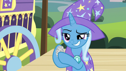 Size: 1280x720 | Tagged: safe, screencap, trixie, pony, g4, uncommon bond, crumpled, female, grin, hoof hold, mare, newspaper, smiling, solo