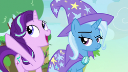 Size: 1280x720 | Tagged: safe, screencap, starlight glimmer, trixie, pony, unicorn, g4, to change a changeling, cape, changeling kingdom, clothes, cute, duo, female, hat, looking up, mare, raised eyebrow, raised hoof, trixie's cape, trixie's hat