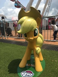 Size: 720x960 | Tagged: safe, photographer:henrychan, applejack, earth pony, human, pony, g4, friendship festival, hong kong, irl, irl human, photo, solo focus, statue