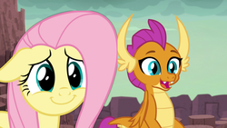 Size: 1896x1068 | Tagged: safe, edit, edited screencap, screencap, fluttershy, smolder, dragon, pegasus, pony, fluttershy leans in, g4, uprooted, cute, dragon lands, dragoness, female, floppy ears, shyabetes, smiling, smolderbetes