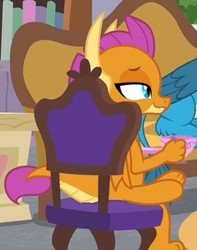 Size: 547x695 | Tagged: safe, screencap, gallus, smolder, dragon, griffon, g4, the point of no return, chair, cropped, crossed legs, cup, dragoness, duo, fangs, female, folded wings, horns, lidded eyes, paws, sitting, slit pupils, smiling, solo focus, teacup, teenaged dragon, teenager, toes, wings