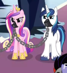 Size: 673x724 | Tagged: safe, screencap, princess cadance, shining armor, pony, unicorn, g4, the beginning of the end, chains, cropped, duo focus, female, gag, male, mare, mind control, muzzle, muzzle gag, prisoner, sombra soldier, stallion