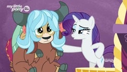 Size: 1366x768 | Tagged: safe, screencap, rarity, yona, pony, unicorn, yak, g4, she's all yak, beautiful, bipedal, blue hair, cloven hooves, cute, discovery family logo, duo, eyeshadow, female, fit right in, frown, hair bow, hoof on hip, horns, lidded eyes, makeup, mare, mentor and protege, monkey swings, raised eyebrow, singing, sitting, teenager, waiting, wig, yonadorable