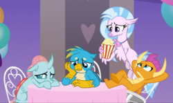 Size: 1606x957 | Tagged: safe, screencap, gallus, ocellus, silverstream, smolder, changedling, changeling, classical hippogriff, dragon, griffon, hippogriff, g4, she's all yak, arm behind head, chair, claws, cropped, crossed legs, curved horn, cute, diaocelles, diastreamies, dragoness, feet on table, female, flapping, flippance, flying, folded wings, food, gallabetes, group, guilty, hand on cheek, horn, horns, jewelry, looking down, looking up, necklace, pearl necklace, popcorn, sad, sad face, sitting, smolderbetes, spread wings, sulking, table, talons, teenaged dragon, teenager, toes, underfoot, wings