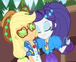 Size: 846x682 | Tagged: safe, screencap, applejack, rarity, equestria girls, festival filters, g4, my little pony equestria girls: better together, applejack's sunglasses, best friends, female, hat, phone, shipping fuel, sunglasses, uncomfortable