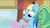 Size: 1280x720 | Tagged: safe, screencap, rainbow dash, pegasus, pony, g4, my little pony: friendship is magic, the lost treasure of griffonstone, alternate hairstyle, book, discovery family logo, fake smile, female, hoof hold, imitation, looking down, manebow sparkle, manual, multicolored mane, reading, smiling, solo, train