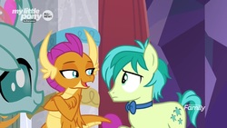 Size: 1280x720 | Tagged: safe, screencap, ocellus, sandbar, smolder, changedling, changeling, dragon, earth pony, pony, g4, she's all yak, amused, bowtie, claws, confused, crossed arms, curved horn, cutie mark, dragoness, fangs, female, folded wings, frown, horn, horns, lidded eyes, male, open mouth, smiling, smirk, smugder, teenaged dragon, teenager, trio, wings, young stallion