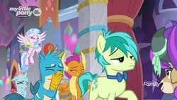 Size: 1280x720 | Tagged: safe, screencap, gallus, ocellus, sandbar, silverstream, smolder, yona, changedling, changeling, classical hippogriff, dragon, earth pony, griffon, hippogriff, pony, yak, g4, she's all yak, amused, balloon, blinking, bowtie, claws, confused, covering mouth, cupcake, curved horn, cutie mark, discovery family logo, dragoness, eyes closed, eyeshadow, female, flying, folded wings, food, frown, horn, horns, laughing, makeover, makeup, male, oh my god, raised hoof, smiling, snickering, spread wings, stallion, student six, talons, teenaged dragon, teenager, wig, wings