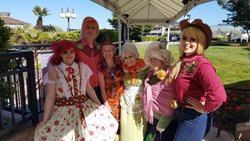 Size: 2048x1152 | Tagged: safe, artist:maddymoiselle, artist:sarahndipity cosplay, artist:shelbeanie, photographer:thornwingmlp, apple bloom, applejack, big macintosh, granny smith, pear butter, human, g4, apple family, beautiful, clothes, cosplay, costume, everfree northwest, handsome, irl, irl human, photo, tabitha st. germain, voice actor