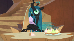 Size: 1800x1013 | Tagged: safe, screencap, mean twilight sparkle, queen chrysalis, changeling, changeling queen, frenemies (episode), g4, crossed hooves, cupcake, dead, female, food, hoof hold, log, solo, twilog
