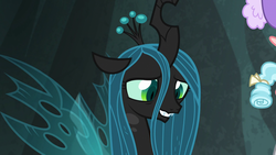 Size: 1920x1080 | Tagged: safe, screencap, cozy glow, queen chrysalis, changeling, changeling queen, frenemies (episode), g4, fangs, female, looking down, smiling, solo focus