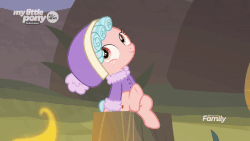 Size: 600x338 | Tagged: safe, screencap, cozy glow, pegasus, pony, frenemies (episode), g4, season 9, animated, clothes, cozybetes, cute, discovery family logo, female, filly, fire, foal, freckles, gif, hat, hnnng, leg wiggle, looking up, perfect loop, sitting, solo, talking, tree stump, winter outfit