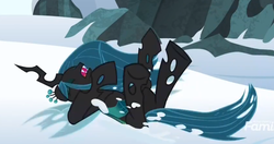 Size: 902x476 | Tagged: safe, screencap, queen chrysalis, changeling, changeling queen, frenemies (episode), g4, female, on back, snow, solo