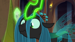 Size: 1920x1080 | Tagged: safe, screencap, queen chrysalis, changeling, frenemies (episode), g4, confused, crown, evil lair, female, fire, former queen chrysalis, frown, glowing horn, grogar's lair, horn, jewelry, lair, log, looking down, regalia, slit pupils, solo, torch, wide eyes