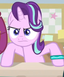 Size: 558x665 | Tagged: safe, screencap, smolder, starlight glimmer, alicorn, dragon, pony, g4, season 9, student counsel, angry, bracelet, cropped, dragoness, female, frown, hooves on the table, jewelry, mare, offscreen character, solo focus, starlight glimmer is not amused, starlight's bracelet, unamused