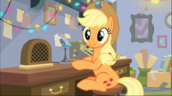 Size: 1368x768 | Tagged: safe, screencap, applejack, earth pony, pony, g4, hearth's warming shorts, my little pony best gift ever, mystery voice, applejack's hat, cowboy hat, cute, desk, female, hat, jackabetes, looking at you, mare, microphone, radio, sitting, smiling, solo