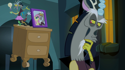 Size: 1280x720 | Tagged: safe, screencap, discord, fluttershy, draconequus, g4, twilight's kingdom, discord lamp, hand on chin, lamp, male, picture frame, reaction image, solo, thinking