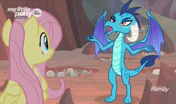 Size: 1482x882 | Tagged: safe, screencap, fluttershy, princess ember, dragon, pegasus, pony, g4, sweet and smoky, discovery family logo, dragon egg, dragon lord ember, female, hole, mare, nest, spread arms
