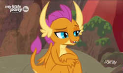 Size: 1278x758 | Tagged: safe, screencap, smolder, dragon, g4, sweet and smoky, claws, cute, discovery family logo, dragoness, fangs, female, folded wings, horns, lidded eyes, raised eyebrow, raised tail, sitting, smiling, smolderbetes, solo, tail, teenager, wings, young