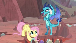 Size: 1920x1080 | Tagged: safe, screencap, fluttershy, princess ember, dragon, pegasus, pony, g4, sweet and smoky, amused, claws, crossed arms, dragon egg, dragon lands, egg, female, folded wings, horns, lidded eyes, looking up, mare, open mouth, smiling, wings
