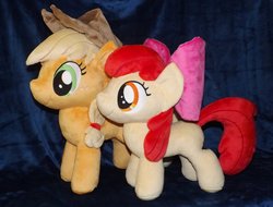 Size: 1280x974 | Tagged: safe, artist:peruserofpieces, apple bloom, applejack, earth pony, pony, accessory, bow, comparison, cowboy hat, duo, female, filly, happy, hat, irl, mare, photo, plushie, profile, siblings, side by side, sisters, smiling, toy