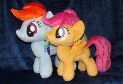Size: 1280x875 | Tagged: safe, artist:peruserofpieces, rainbow dash, scootaloo, pegasus, pony, g4, blank flank, comparison, duo, female, filly, happy, irl, mare, photo, plushie, profile, rainbow dash plushie, scootaloo plushie, side by side, smiling, spread wings, toy, wings