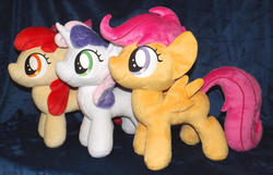 Size: 1280x824 | Tagged: safe, artist:peruserofpieces, apple bloom, scootaloo, sweetie belle, earth pony, pegasus, pony, unicorn, g4, accessory, bow, cutie mark crusaders, female, filly, happy, horn, irl, photo, plushie, profile, ribbon, side by side, smiling, toy, trio, wings