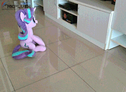 Size: 400x295 | Tagged: safe, artist:nekokevin, starlight glimmer, twilight sparkle, alicorn, pony, unicorn, series:nekokevin's glimmy, g4, animated, big pony chasing little pony, chase, clothes, cute, duo, female, gif, glimmerbetes, horses doing horse things, irl, mare, nekokevin is trying to murder us, photo, plushie, socks, starlight's little twibird, stop motion, striped socks, teleportation, twiabetes, twilight sparkle (alicorn), weapons-grade cute