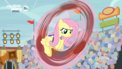 Size: 1366x768 | Tagged: safe, screencap, fluttershy, pony, common ground, g4, audience, blurry, crowd, fast, female, flag, lights, mare, solo, spinning, spotlight, stadium