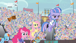 Size: 1366x768 | Tagged: safe, screencap, fluttershy, pinkie pie, rainbow dash, pony, common ground, g4, audience, clothes, coach rainbow dash, crowd, disappointed, facehoof, flag, flying, jersey, lights, spotlight, stadium, unamused