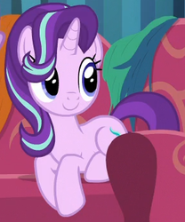 Size: 289x348 | Tagged: safe, screencap, starlight glimmer, pony, unicorn, g4, it isn't the mane thing about you, behaving like a cat, couch, cropped, cute, female, glimmerbetes, hair over one eye, mare, sitting, smiling, solo