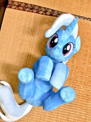 Size: 768x1024 | Tagged: safe, artist:nekokevin, trixie, pony, unicorn, g4, cute, diatrixes, female, hooves together, irl, looking at you, lying down, mare, on back, photo, plushie, smiling, solo, underhoof