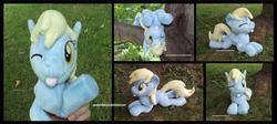 Size: 3900x1754 | Tagged: safe, artist:peruserofpieces, derpy hooves, pegasus, pony, g4, :p, beanie (plushie), cute, derpabetes, female, folded wings, irl, mare, one eye closed, photo, plushie, prone, solo, sploot, tongue out, tree, waving, wings, wink