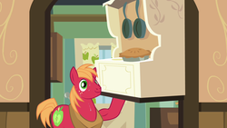 Size: 1280x720 | Tagged: safe, screencap, big macintosh, earth pony, pony, g4, pinkie apple pie, biceps, food, frying pan, hoof hold, horse collar, male, oven, pie, smiling, solo, stallion, stove