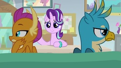 Size: 1920x1080 | Tagged: safe, screencap, gallus, smolder, starlight glimmer, dragon, griffon, pony, unicorn, g4, student counsel, angry, annoyed, bickering, bracelet, claws, couch, desk, dragoness, duo, facing away, female, folded wings, frown, gallus is not amused, guidance counselor, hand on cheek, indifferent, jewelry, lidded eyes, male, mare, scowl, starlight's office, trio, unamused, wings