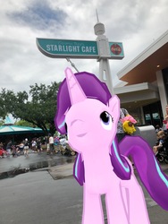 Size: 3024x4032 | Tagged: safe, photographer:undeadponysoldier, starlight glimmer, human, pony, unicorn, g4, augmented reality, building, carousel, cosmic ray's starlight cafe, disney world, female, i see what you did there, irl, irl human, looking up, magic kingdom, mare, namesake, not photoshoped, photo, ponies in real life, puddle, pun, restaurant, sign, vacation
